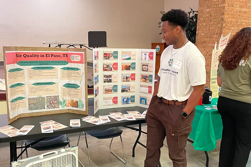 Man looking at a display of air quality.